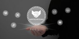 Wertschätzung Man sieht einen Kreis mit dem Wort Wertschätzung neben kleineren Kreisen mit verschiedenen Symbolen.